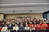 Group photo of all EAW participants in the auditorium of the HWG LU