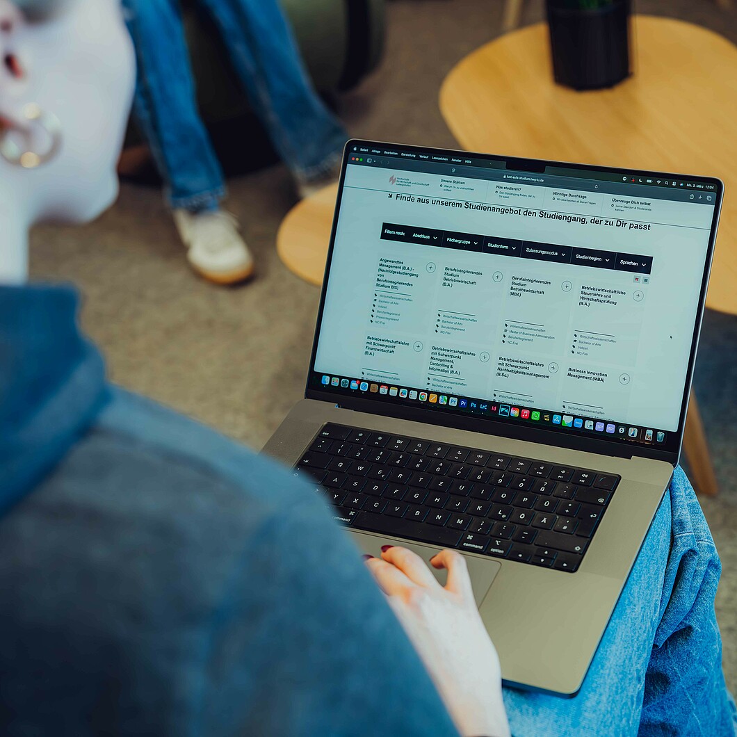 Students in front of a laptop