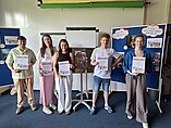 Group photo of the winners of the photo competition with their certificates