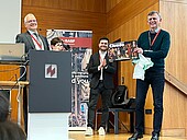 Three people at BASF lecture in the auditorium