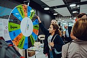 Girl spins the wheel of fortune